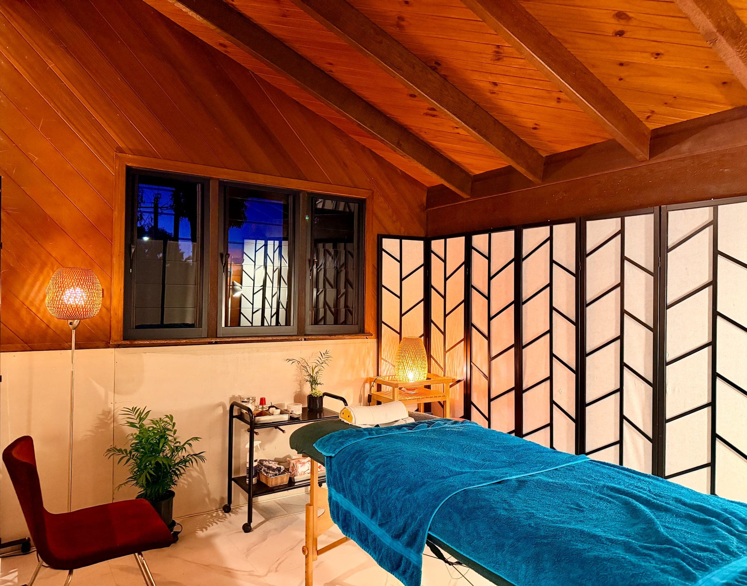 The treatment room at Hideshi Acupuncture in Kewarra Beach, Cairns, with shoji screens and soft evening light